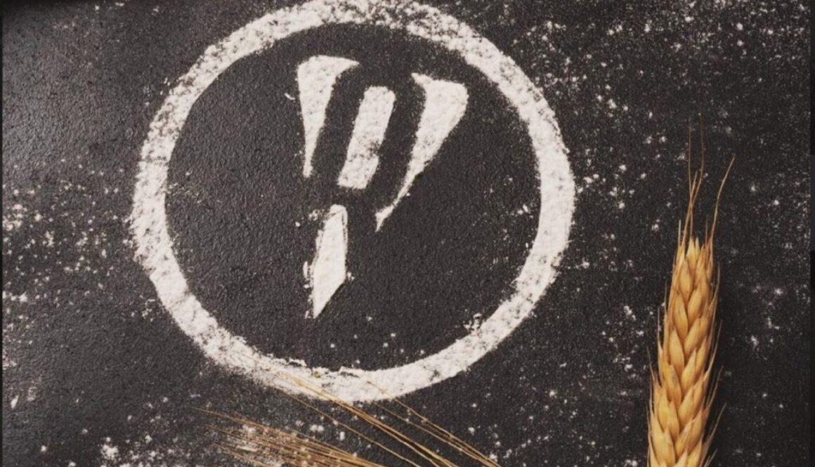 Pizza Rubato company logo made of white flour near a stalk of wheat on a black background